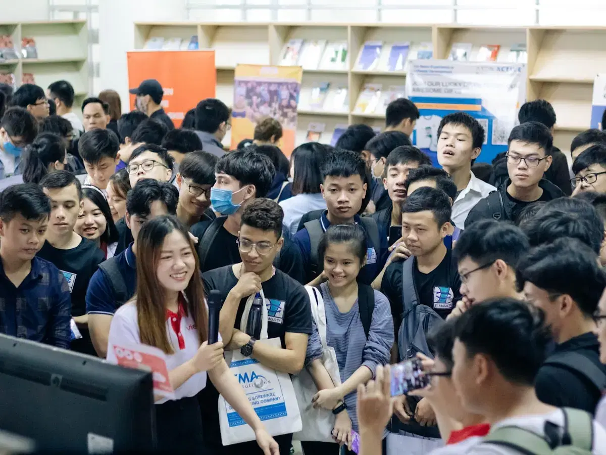 Students gathered at stalls during a busy education fair